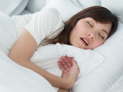 Woman sleeping snoring with mouth open